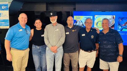 Six people standing together at a Rotary Club of Wendell gathering