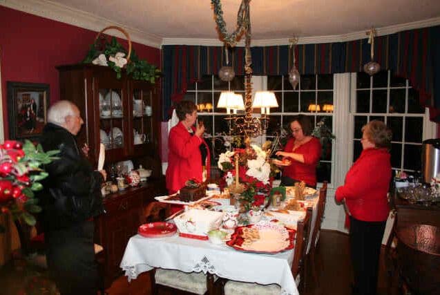 Visitors gathered in a holiday-decorated dining room